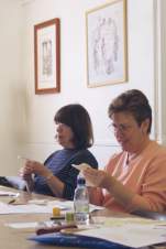 Students stitching at a needlework shop