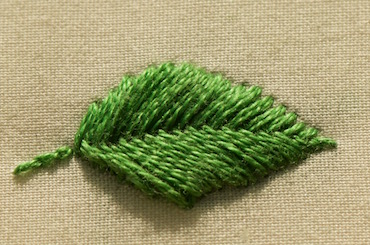 Photo of raised fishbone leaf casting a shadow on the fabric