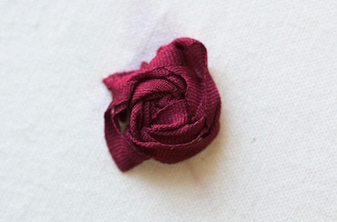 Raised buttonhole stitch flower worked in 4mm silk ribbon