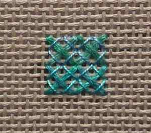 Rice stitch with fine rayon thread for the second layer creating a delicate net effect