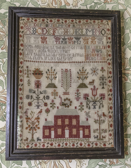 Cross stitch sampler dated 1825 in the Nursery at Wallington