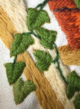 Satin stitch ivy leaves worked in wool