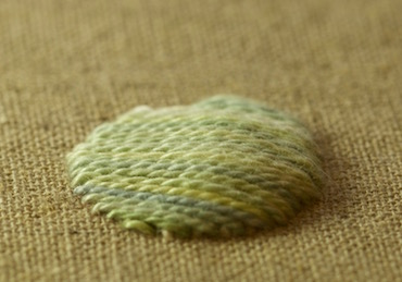 Satin stitch worked over thread padding showing raised effect