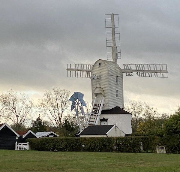Saxtead Green Post Mill in Suffolk with sails turning in the wind