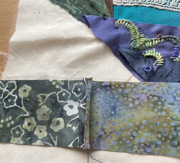 Two new fabrics seamed together to form a replacement strip