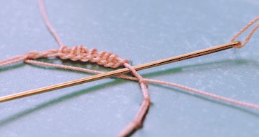 Starting the second row of corded single Brussels stitch, increasing at the edges