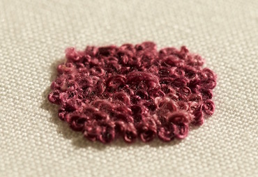 French knots worked on a separate piece of fabric as a slip
