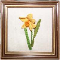 A needlelace daffodil created using couching as part of the process