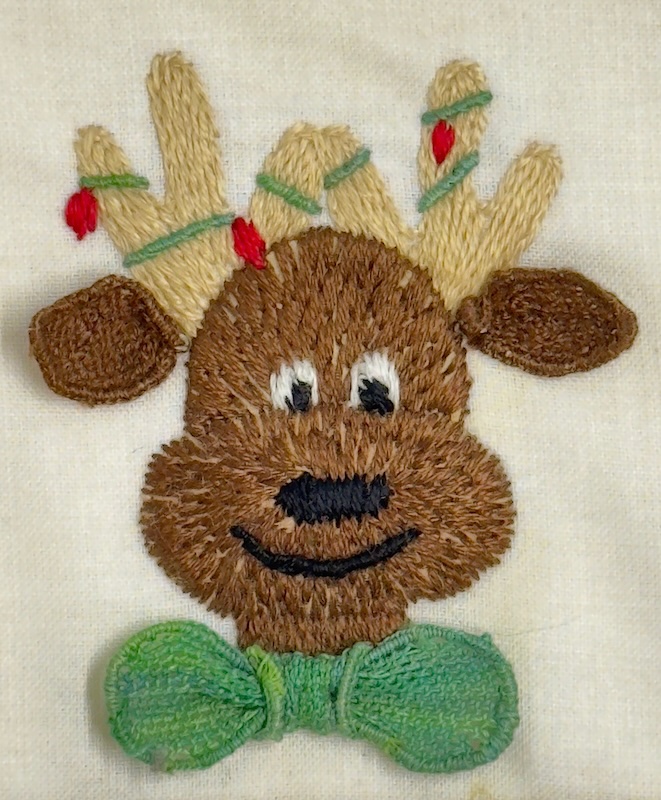 Stumpwork reindeer project showing padding and needlelace techniques