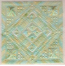 Symmetry needlepoint pattern with diamond eyelets and Rhodes stitches