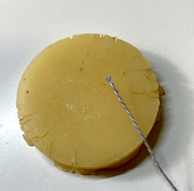 Pearl cotton in front of my beeswax circle