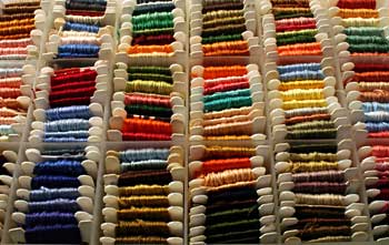 Embroidery floss wound onto bobbins for organised storage