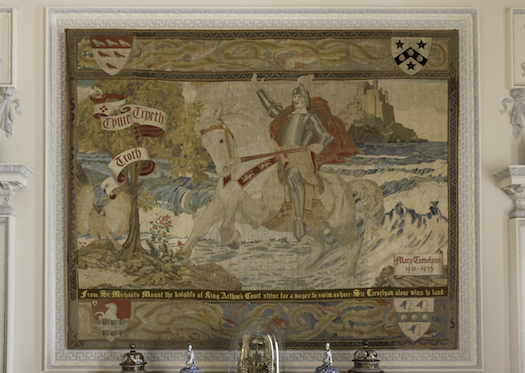 Large needlepoint panel by Molly Trevelyan showing the first Trevelyan on horseback riding ashore at St Michael's Mount