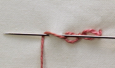 Twisted chain stitch continuing around fish